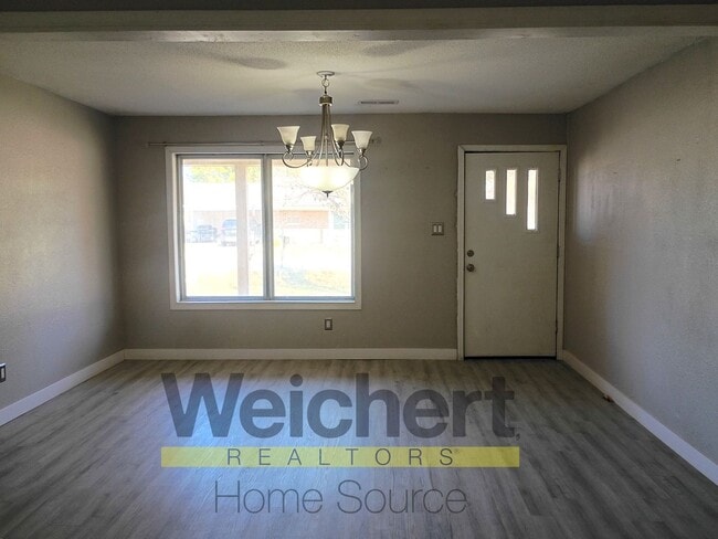 Building Photo - Updated 4-Bed Home with Fenced Yard & Carport