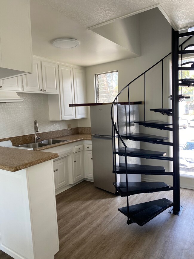 small funky kitchen with refrigerator. - 405 N Broadway