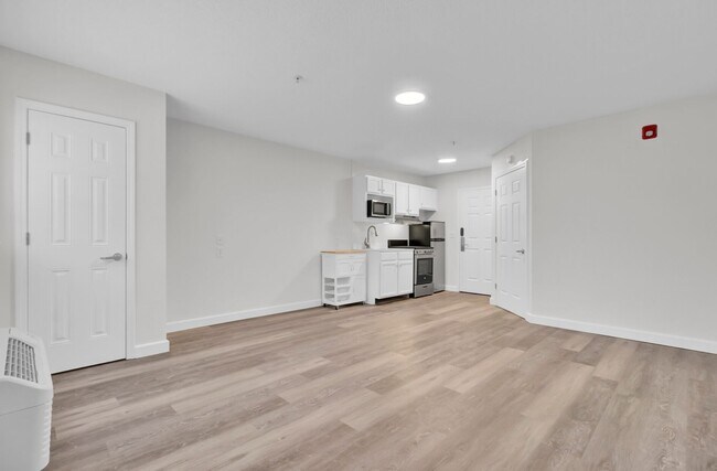 Building Photo - FIRST MONTH FREE- STUDIO APT- Available 1/...