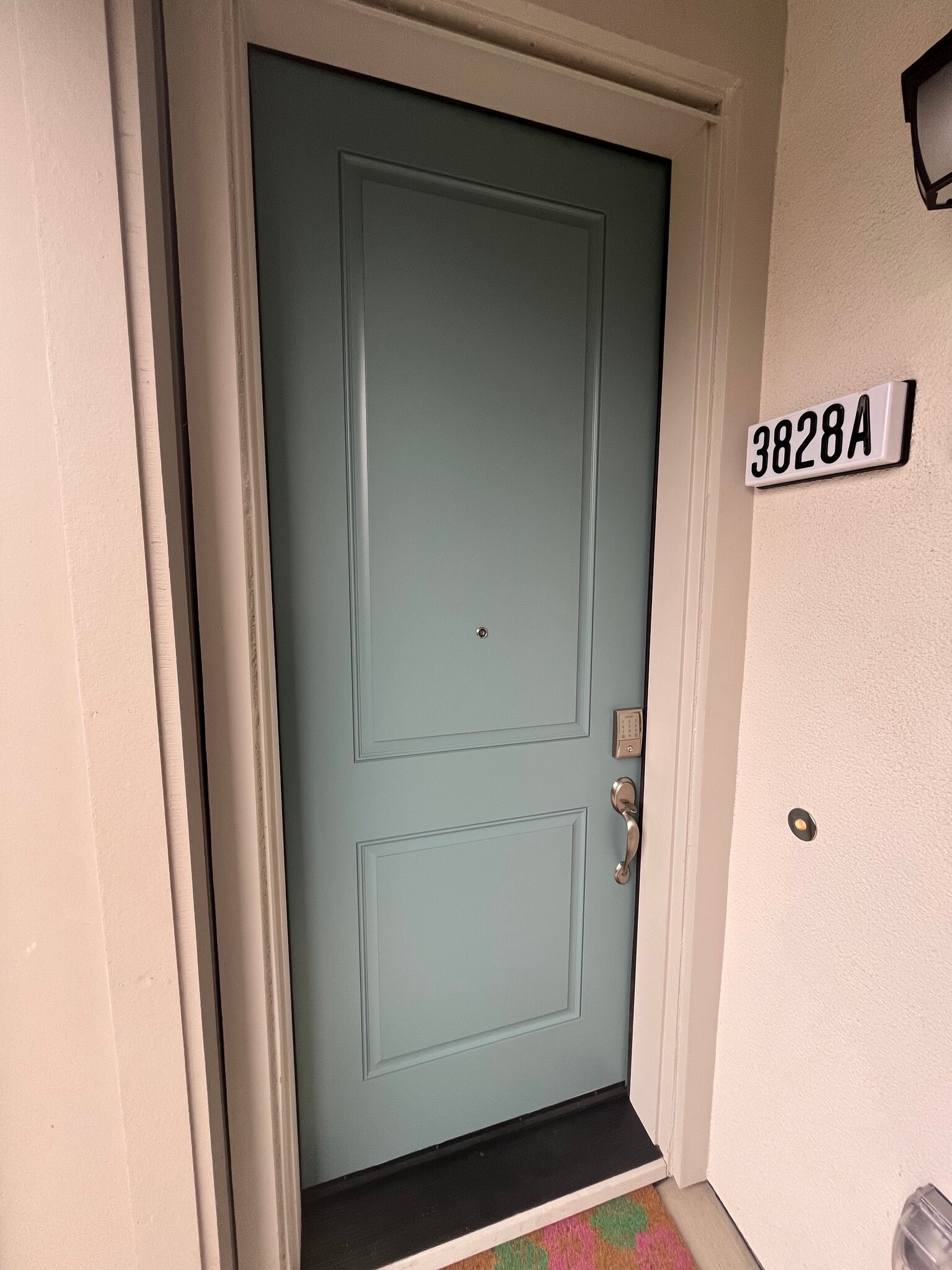 Private front door entrance with keypad lock and doorbell - 3828 Norbridge Ave