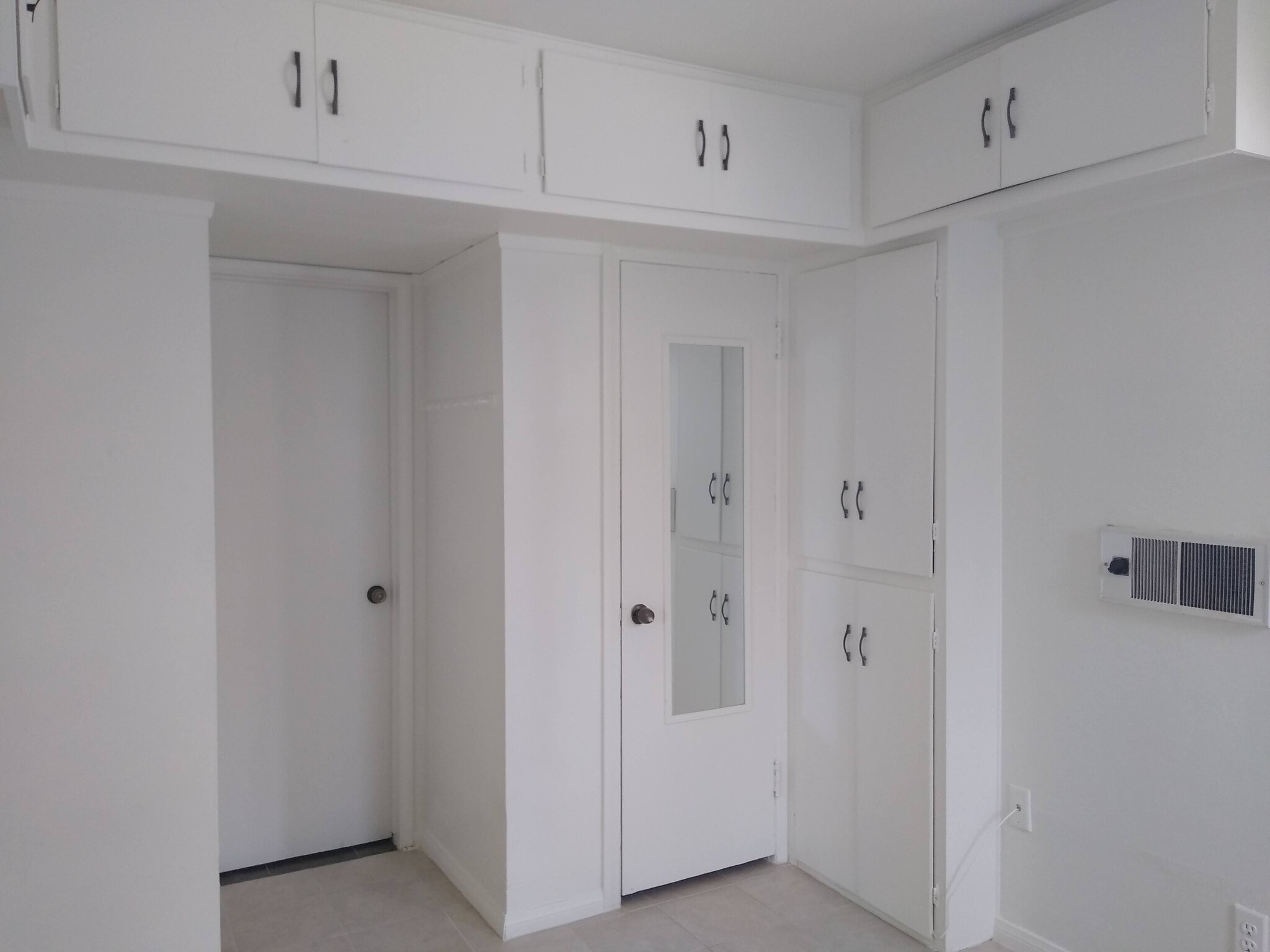 Bedroom with cabinets and wall heater. - 4127 Everts St