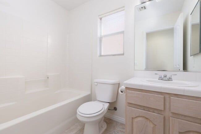 Building Photo - 3-bedroom 2-bathroom town house with a double car garage, freshly painted and new carpet.