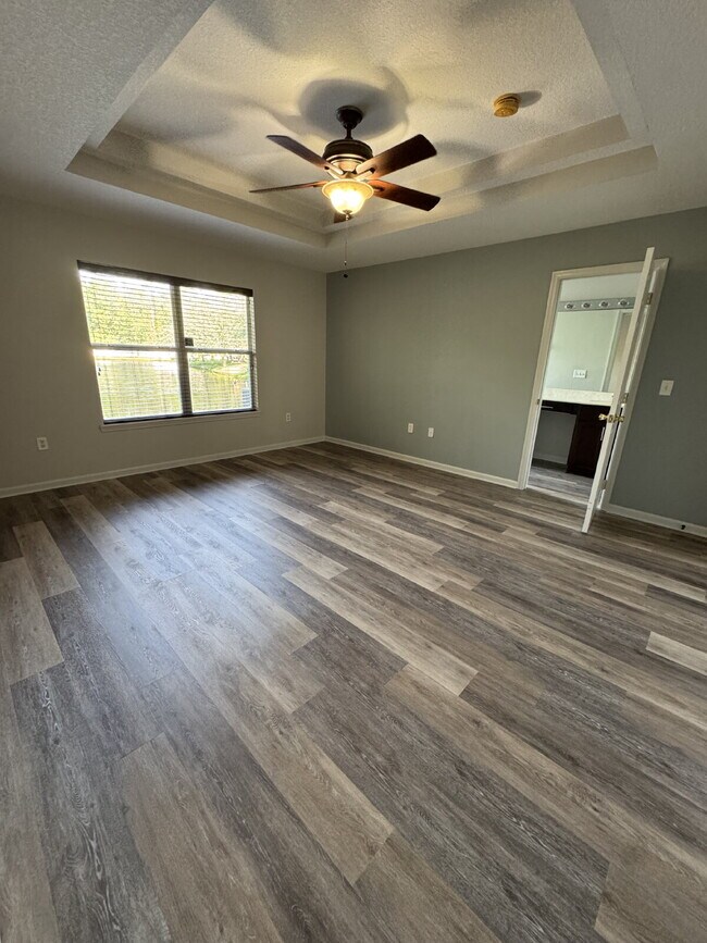 Building Photo - Spacious 4 Bedroom Pond-View Home with Upg...