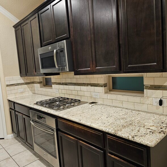 Kitchen with all SS Appliance - 905 Avian Dr