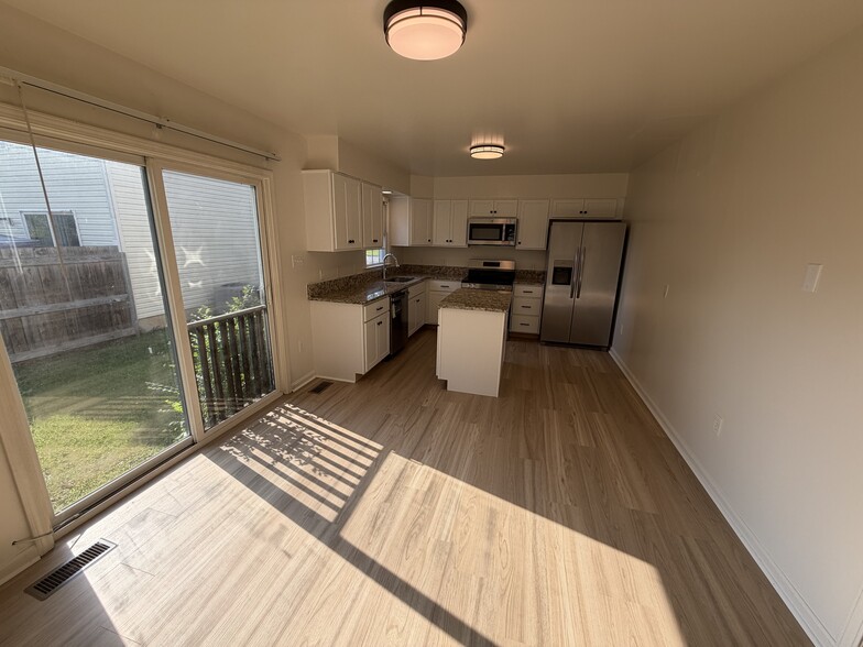 Dining area opens up to kitchen and boasts abundant natural light - 903 Harwood Rd