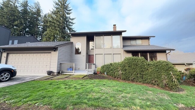 Building Photo - 4bd/3ba HUGE Home w/Hardwood Floors, Russian Fireplace, 2-Car Garage & Fenced Back Yard!