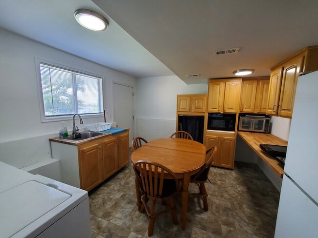 Dining area with fridge - 1020 E 1275 N