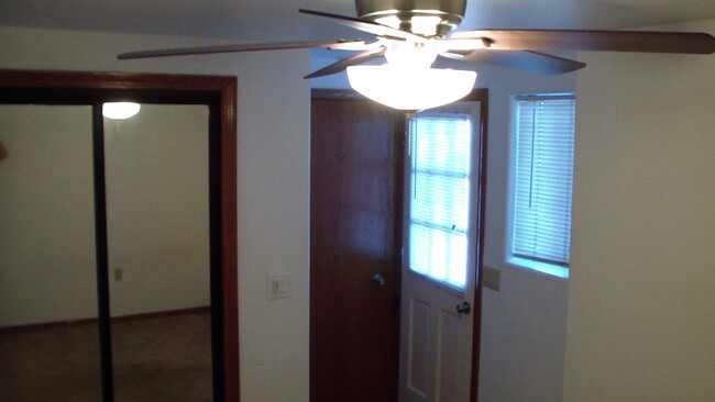 9.5' x 14.5' bedroom with ceiling fan. Mirrored closet doors. - 2373 Mountain View Dr