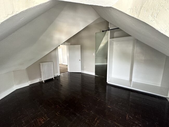 Experience the charm of this versatile attic space, perfect for a quiet retreat. - 1458 N Gaylord St