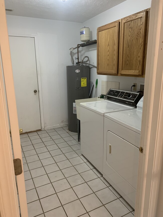 Laundry room with washer and dryer - 1413 Loop Road