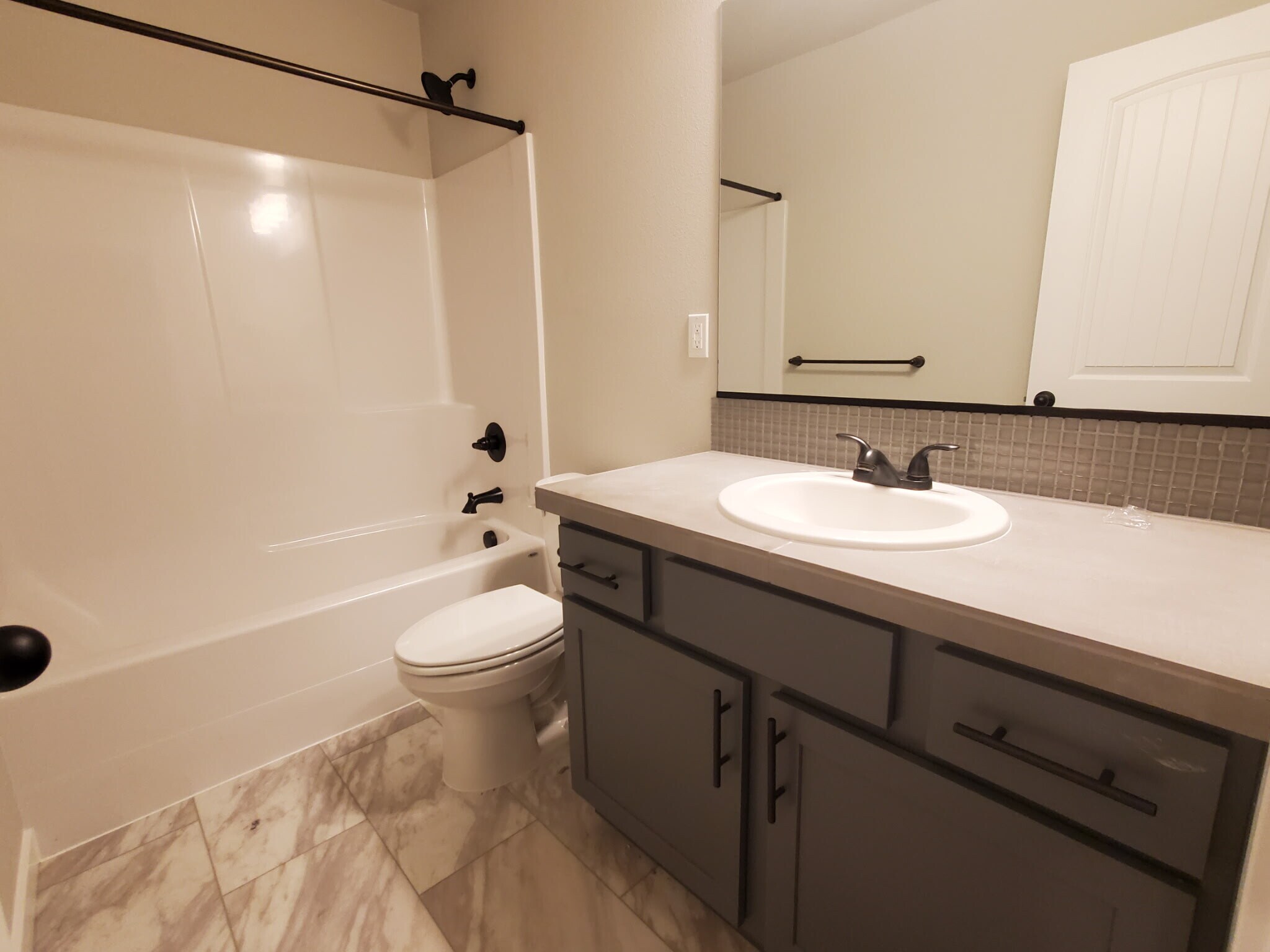 The second full bathroom with tub - 161 E Wayno Way