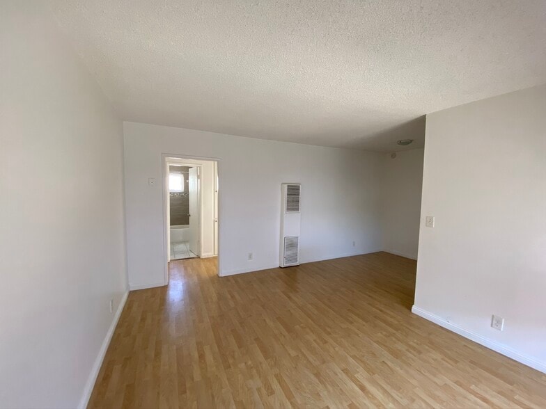 Living room to the left/dining room to the right - 940 S Venice Blvd