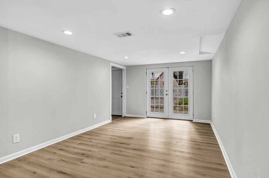 Living room flushed with natural light from French doors - 844 E 37th St