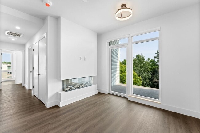 Building Photo - 2 Bedroom Corner-Unit with Wooded Balcony ...