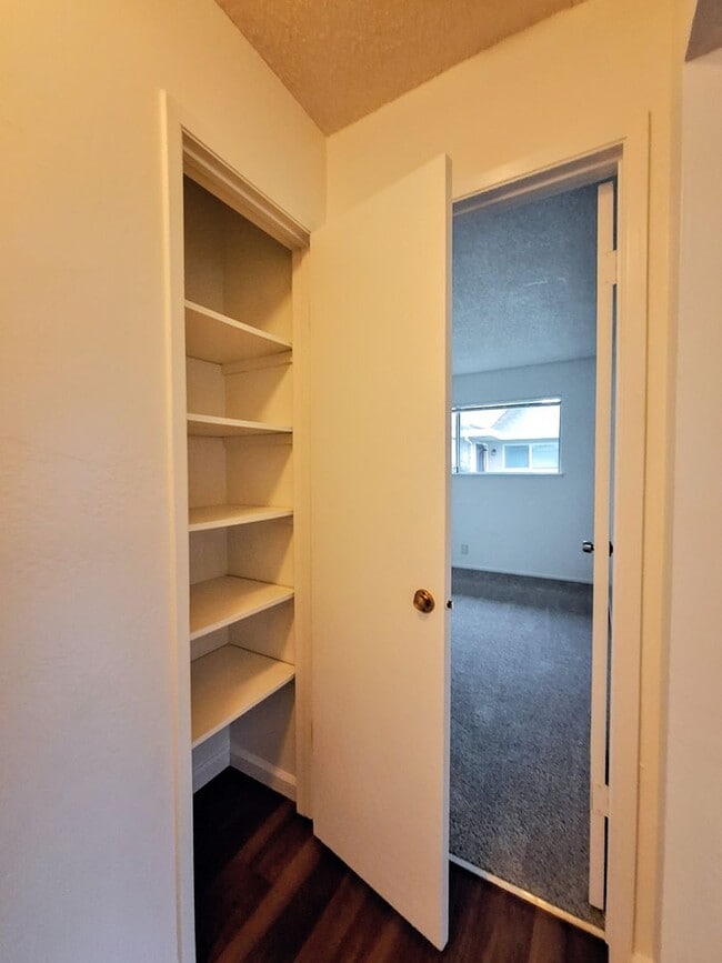 Building Photo - Ground Floor 2bd Condo With On-site Laundry, Carport, & Pool!