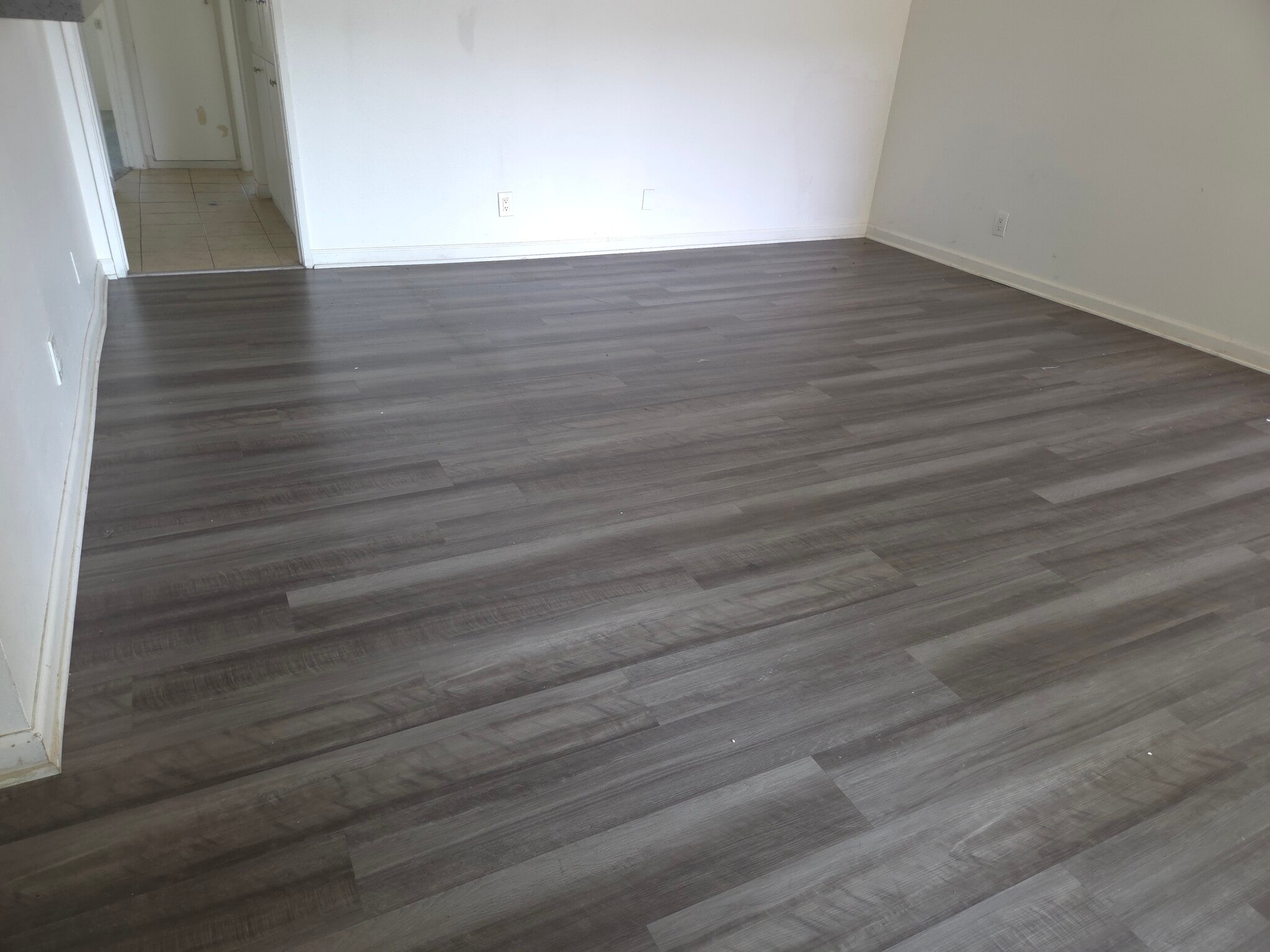 Living room with luxury vinyl plank flooring - 3455 Elm Ave