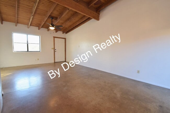 Building Photo - Charming Mid-Century Style: Vaulted Beams & Private Oversized Yard