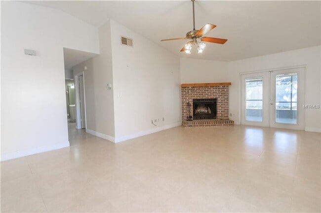 Building Photo - Freshly Painted 3/2 with Fenced Yard & Fireplace!