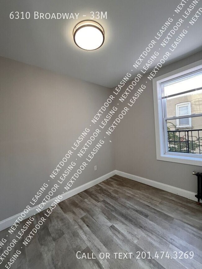 Building Photo - 6310 Broadway-33M