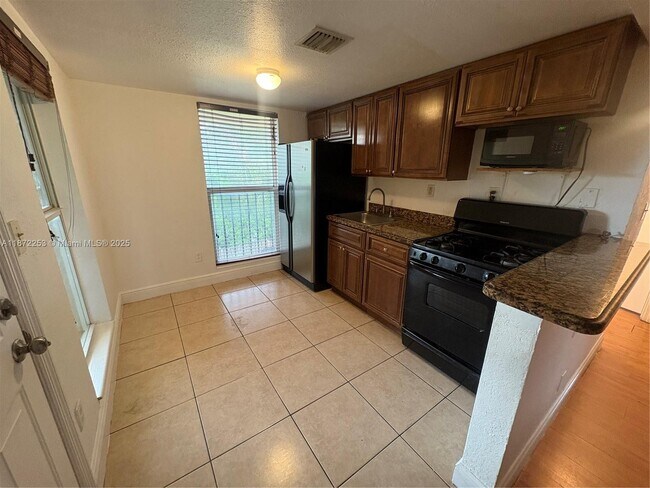 Building Photo - 241 S Royal Poinciana Blvd