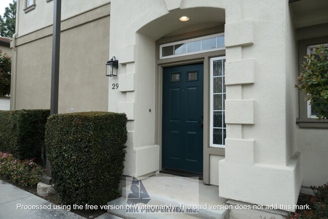 Building Photo - Welcome to this stunning 2-bedroom condo in gated community