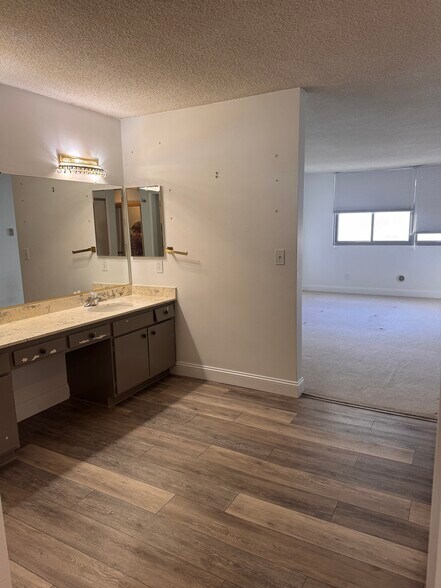 Separate toilet, shower room, dual sink vanity and bedroom - 8701 Delgany Ave