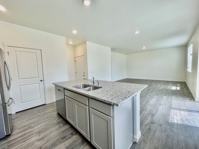 Building Photo - Spacious 4-Bedroom Wellington Home with 3-Car Garage, Loft & Fenced Backyard!