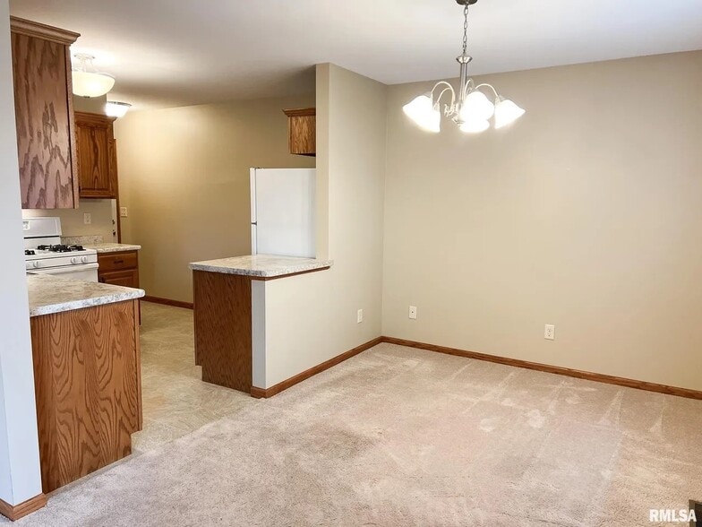 Dining area and kitchen - 1138 Breeze Way