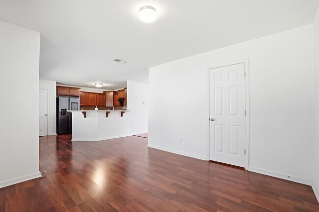 Building Photo - Spacious 4BR Home with New Carpet & Fenced Backyard