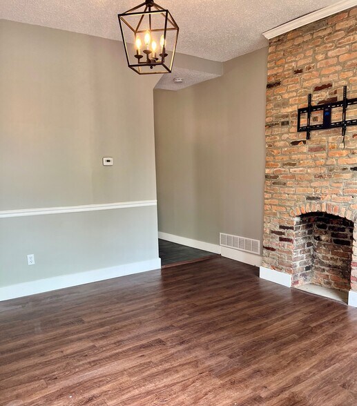 exposed brick and hardwood floors in your living room - 454 Forest St