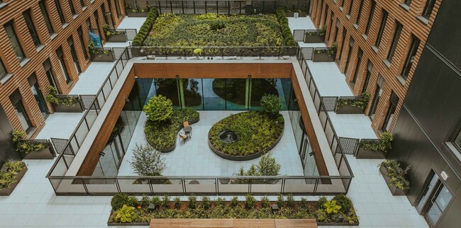Unveil the tranquility of Ruby Chelsea, where lush green spaces meet modern living. Explore serene outdoor areas designed for relaxation and connection. Embrace an urban oasis that elevates your lifestyle. Schedule your visit today! - Ruby Apartments