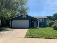 Building Photo - NE House for Rent 4 bedroom 2 full bathroom fenced in yard 2 Car attached garage.