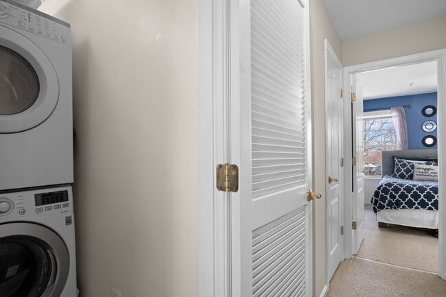 Building Photo - This inviting two-level townhome offers comfort and style, featuring gleaming hardwood floors on ...