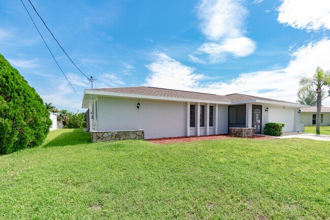 Building Photo - Gulf Access Pool Home. 4BED/2BATH. SE OF CAPE CORAL FL. Special Offer! Qualify for a deposit-free...