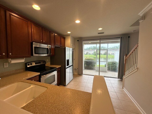 Building Photo - Stunning Townhome With Pond View In Gated Community