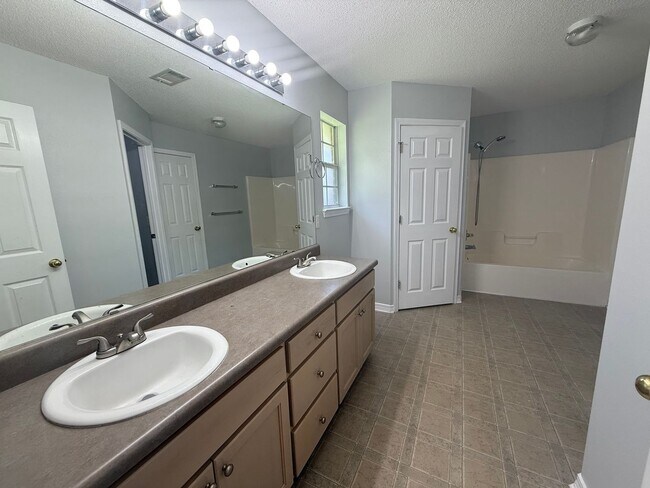 Building Photo - Pace - Spencer Oaks Landing - 4 bedroom, 2 bath w/ lawn care included