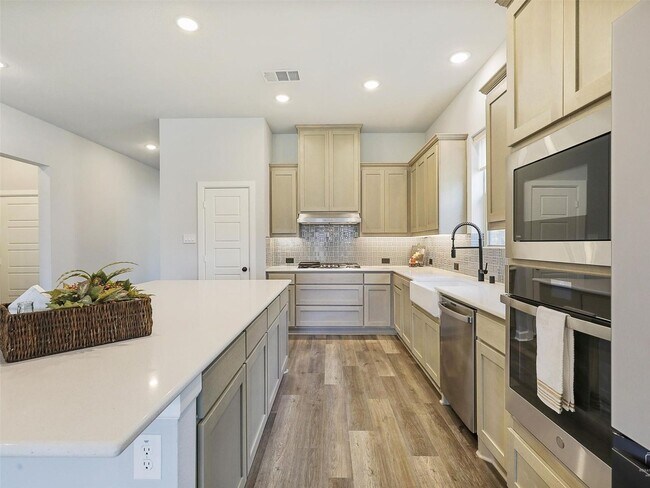 Building Photo - Upgrades galore and ready Now!