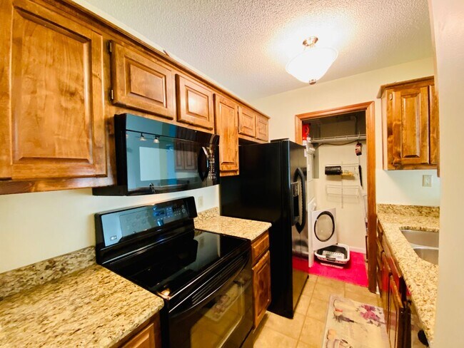 Building Photo - {12030 - F}  Updated Condo in Fantastic Location + Top Floor + Covered Parking Included + Private...