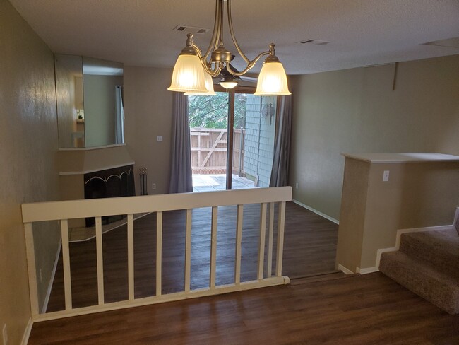 Spacious sunken living room. - 7122 Wood Hollow Dr