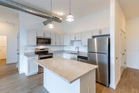 2BR, 2BA - 1180SF - Open Kitchen with Quartz Countertops - Allegheny City Stables Lofts