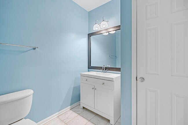 Building Photo - Two-bedroom, two-bathroom model with a den, located on the third floor.