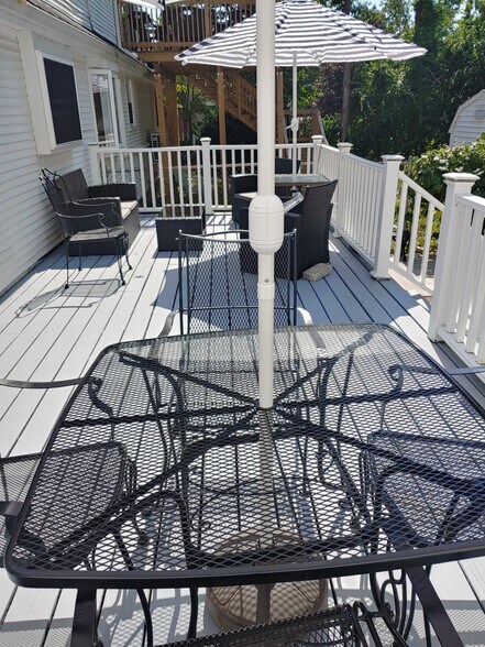 one of two decks and patio area fully furnished with stored pillows - 623 Old West Central St