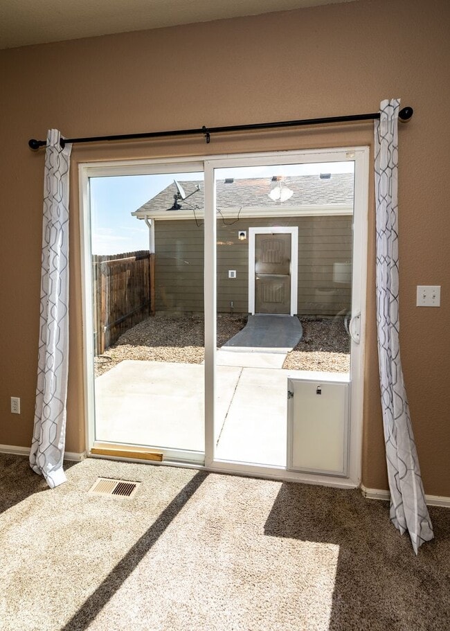 Building Photo - Cute End Unit 3 Bedroom Townhome in Lorson Ranch Next to Open Space