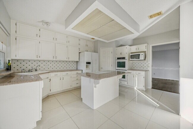 Building Photo - "Coming Soon! Spacious 4-Bedroom, 2.5-Bath Living Meets Storybook Backyard Charm!"