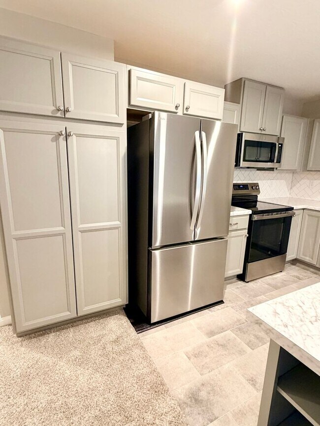 Building Photo - Exquisite just built condo with everything! Ground floor, no stairs, attached garage