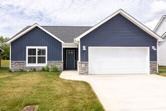 Building Photo - Modern Living Redefined with Stone Fireplace, Gray Cabinetry, Spa Inspired Primary Suite and Cove...