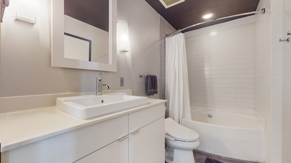 Full bathroom with lots of storage to the left and under sink. Tub/shower is oval and roomy - 730 Stinson Blvd