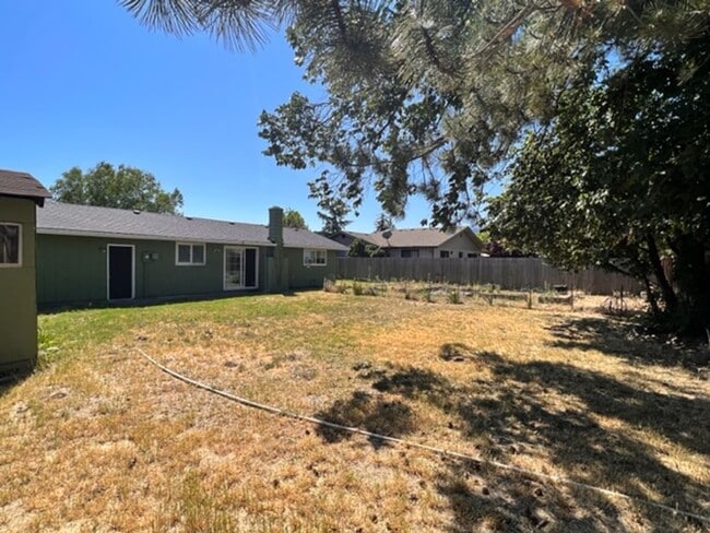 Building Photo - Three bedroom home with large yard| Available July!