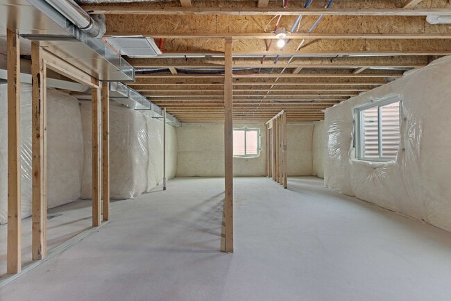 Building Photo - NEW HOME with large garage stalls and unfinished basement for additional storage