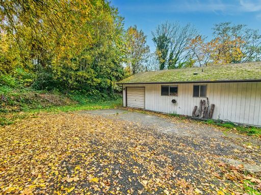 Building Photo - AVAILABLE NOW! Charming West Seattle Home featuring a garage, spacious deck, and wood-burning fir...